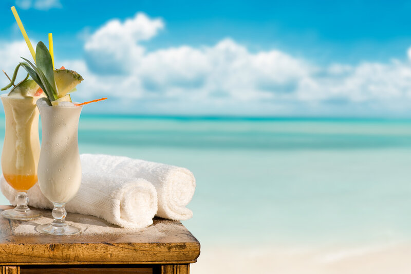 Tropical drinks on beach table