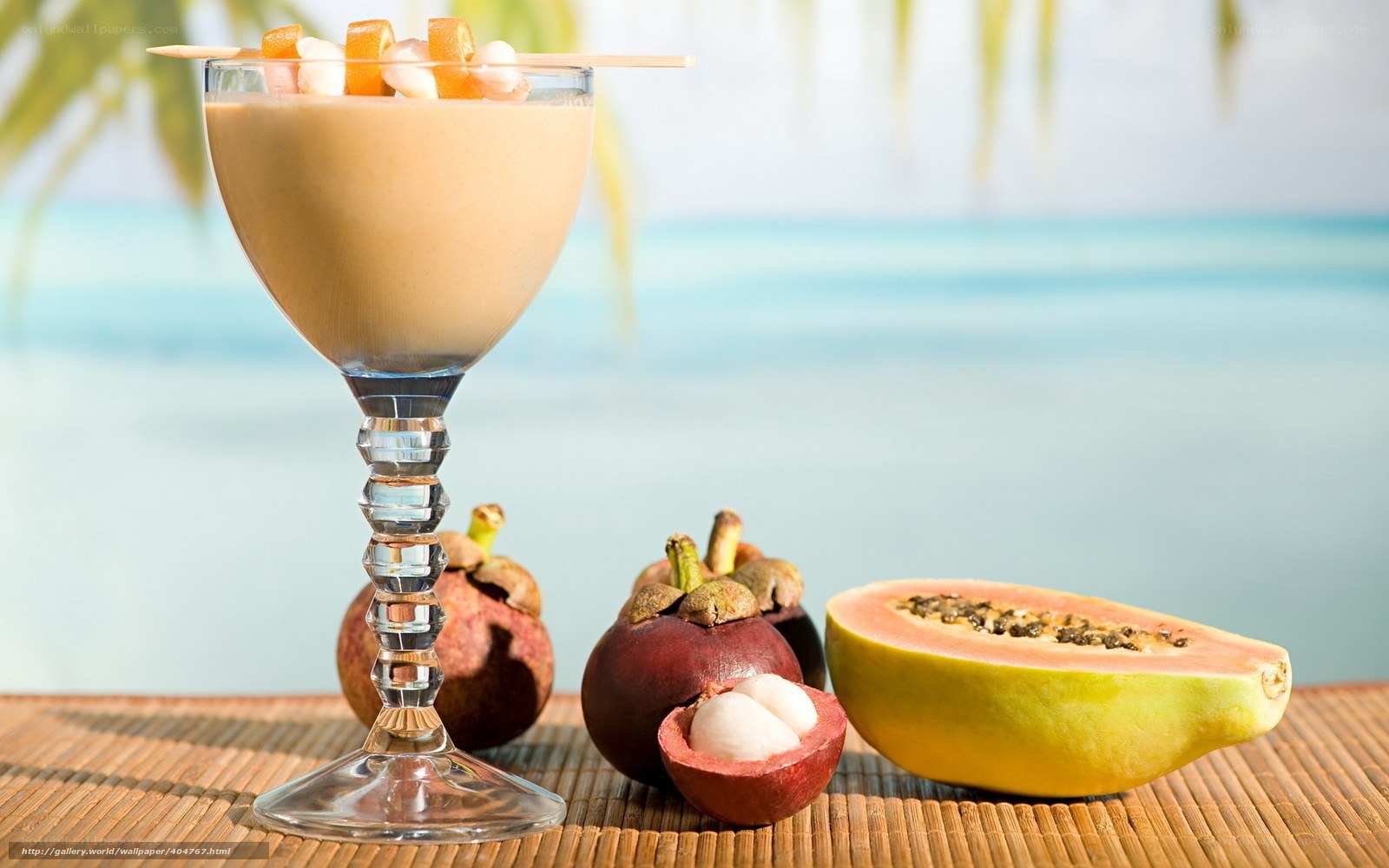 tropical fruit smoothie on beach