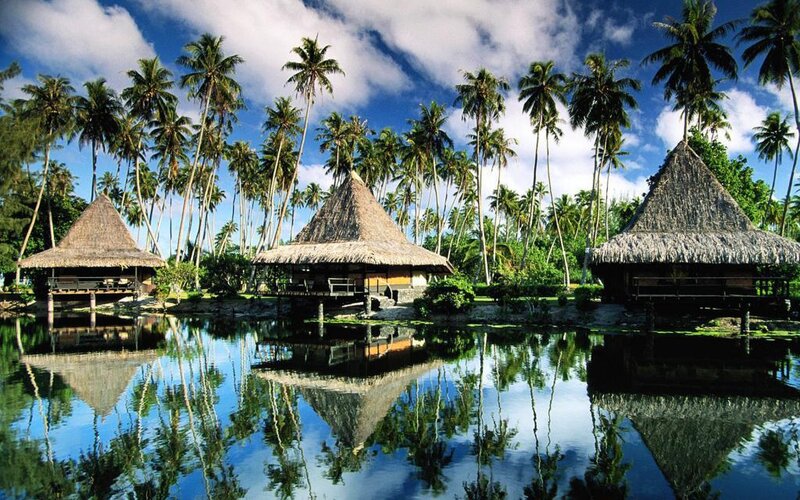 Tropical huts by a lagoon