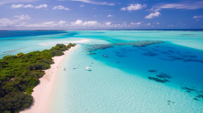 Tropical Island Beach — Blue, Serene, Afternoon, Photograph, Boats
