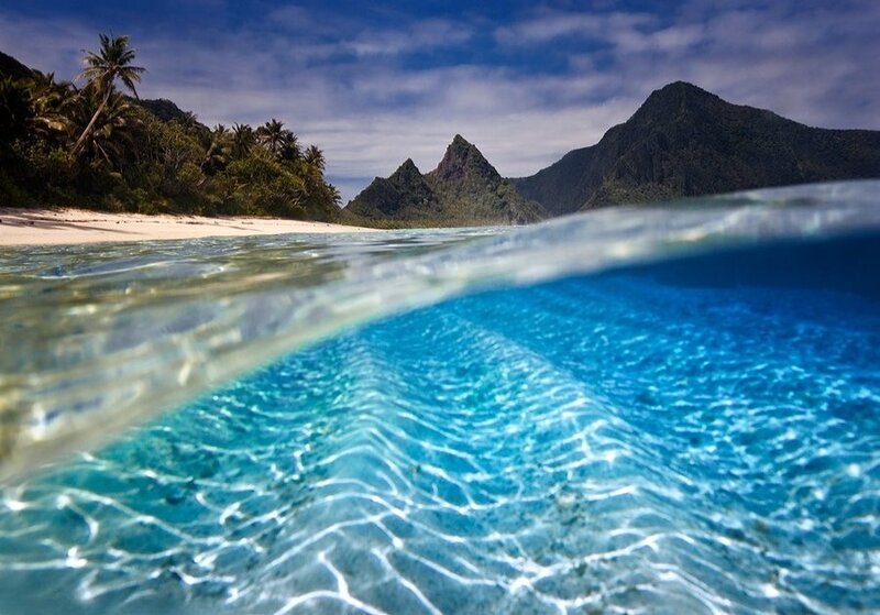 Tropical Island Beach — Blue, Serene, Afternoon, Photograph, Palm Trees, Mountains, Ocean, Green, White
