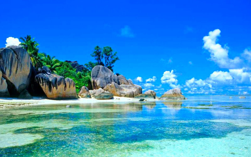 Tropical Island Beach — Blue, Serene, Afternoon, Photograph, Rocks