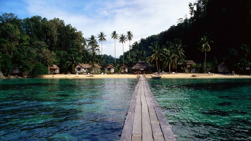 tropical island beach with wooden pier