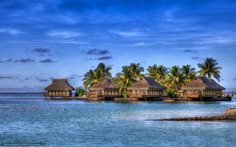 Tropical island bungalows at dusk