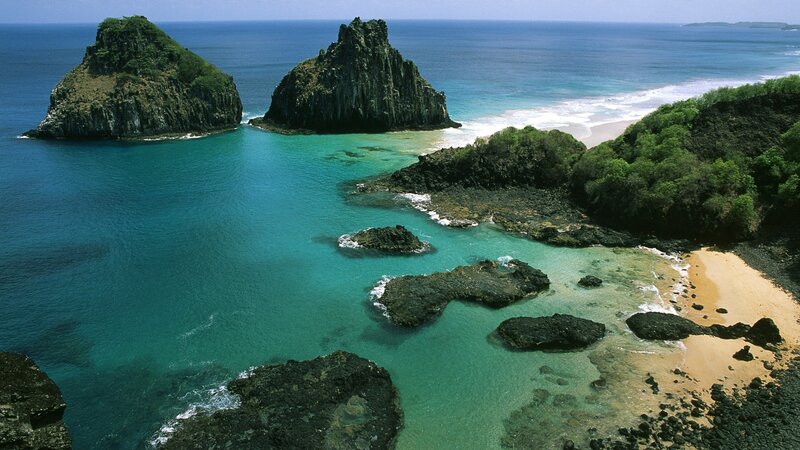 tropical island cove with sea stacks