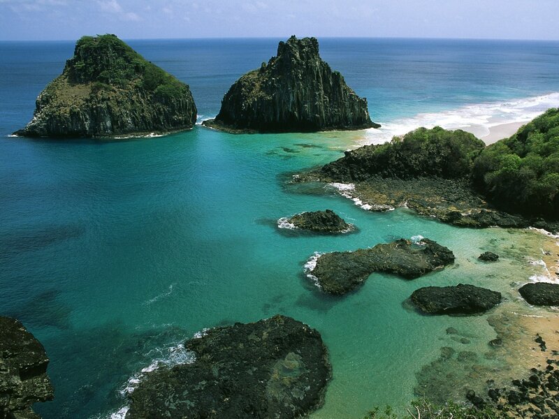 tropical island cove with sea stacks