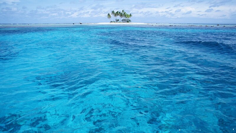 tropical island in blue ocean