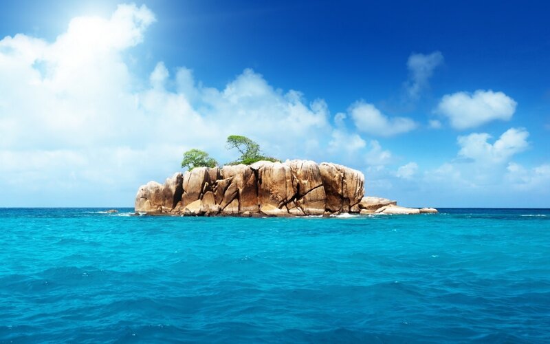 tropical island in blue sea