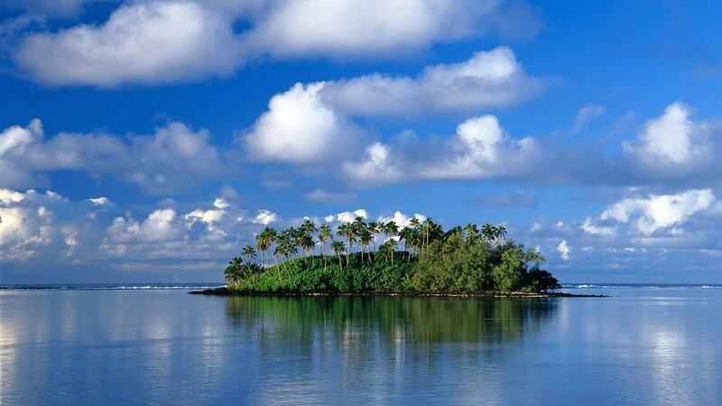 tropical island in calm ocean