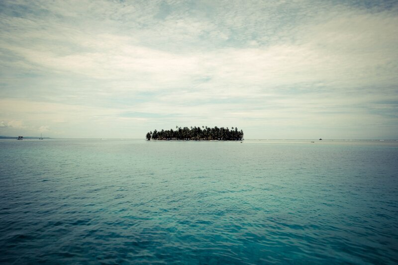 Tropical island in calm sea