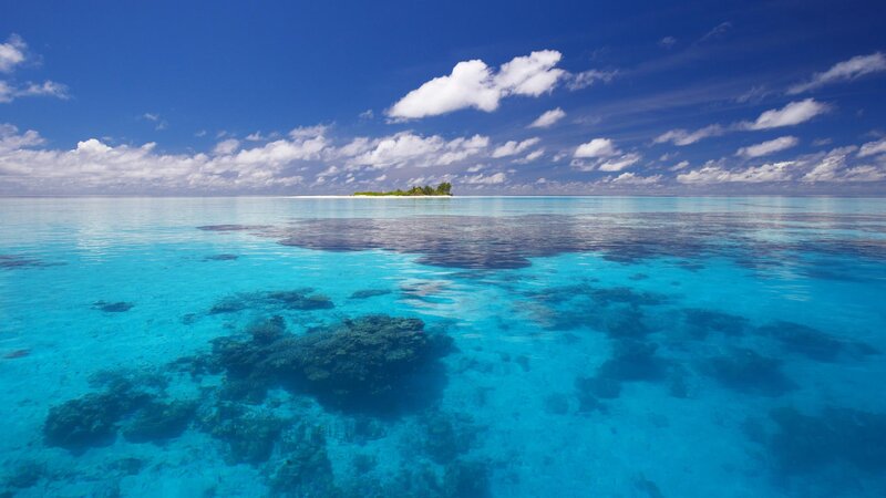 tropical island in clear blue water