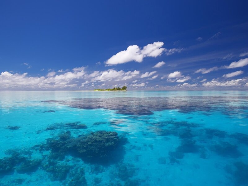 Tropical island in clear blue water