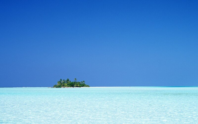 tropical island in clear blue water