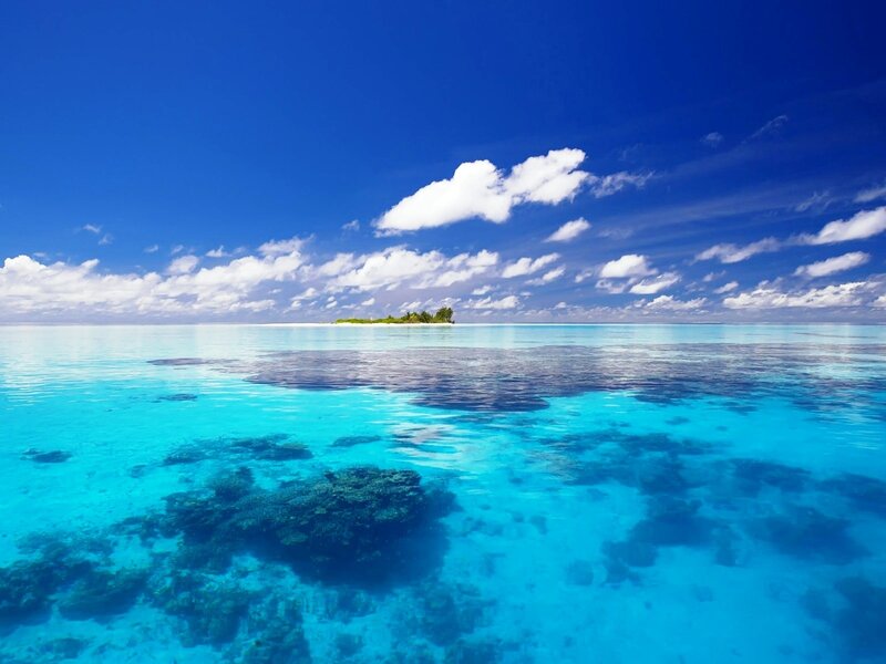 Tropical island in clear blue water