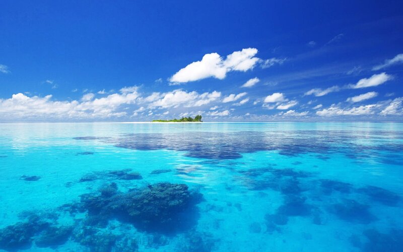 Tropical Island in Ocean — Blue, Serene, Afternoon, Photograph, Clouds