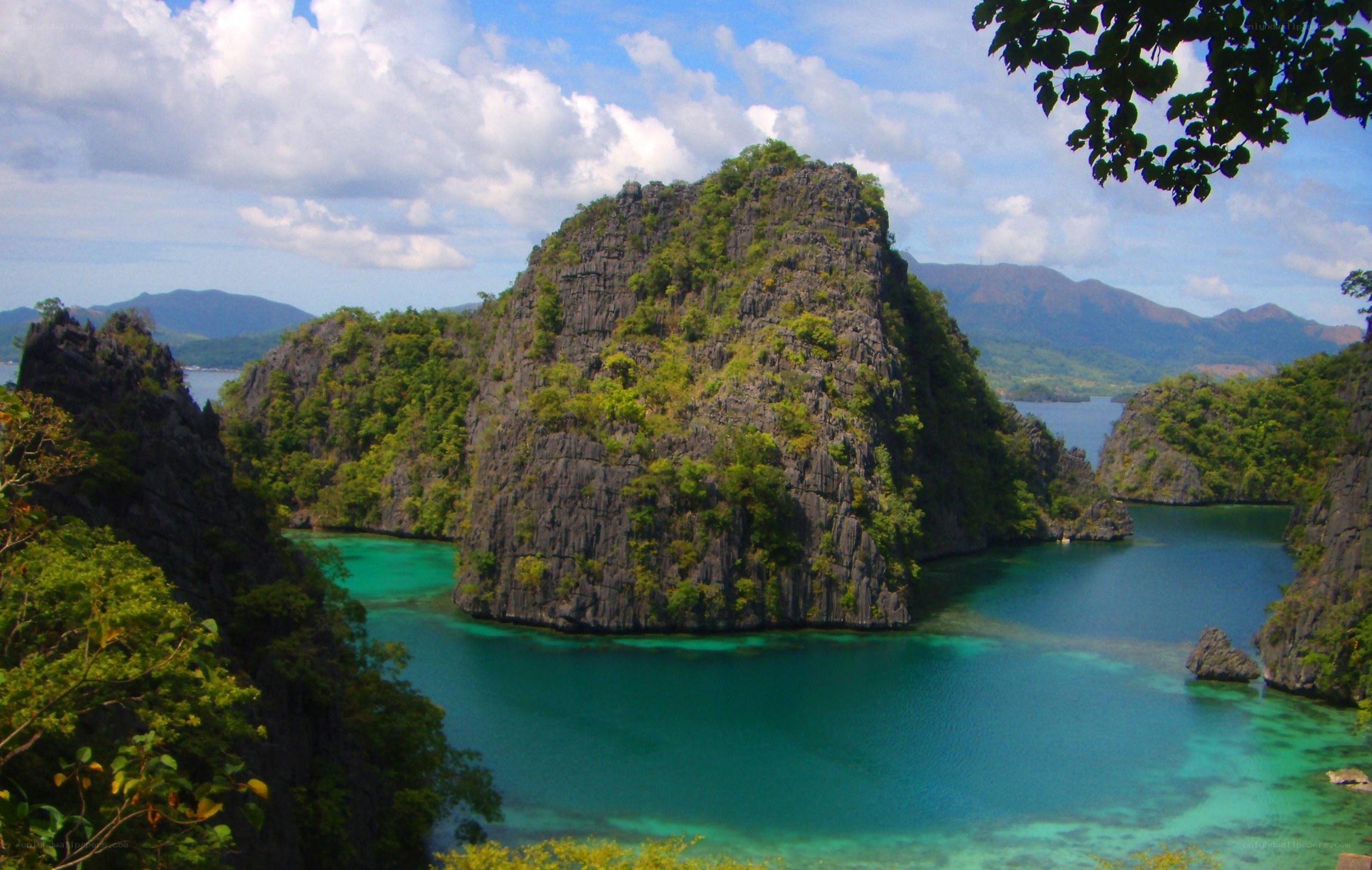 tropical island lagoon with cliffs