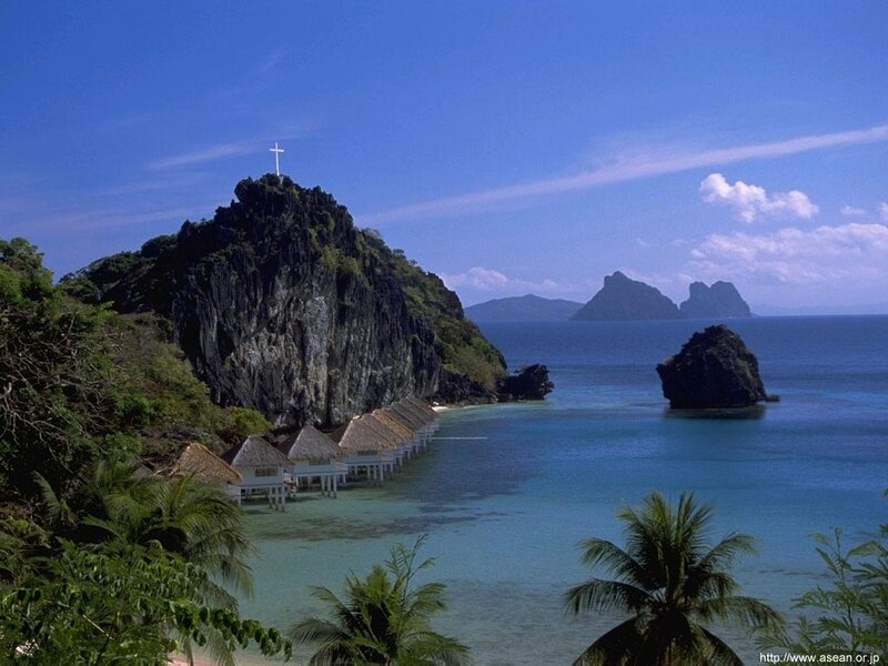 tropical island resort with cross
