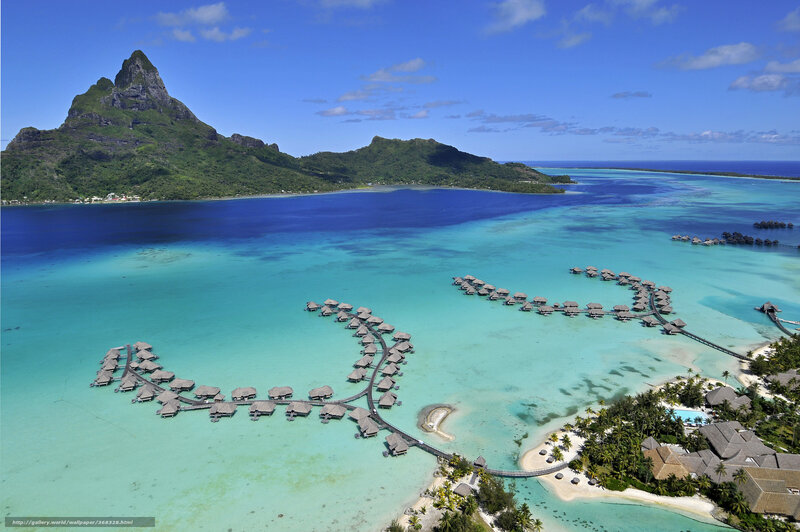 tropical island resort with overwater bungalows