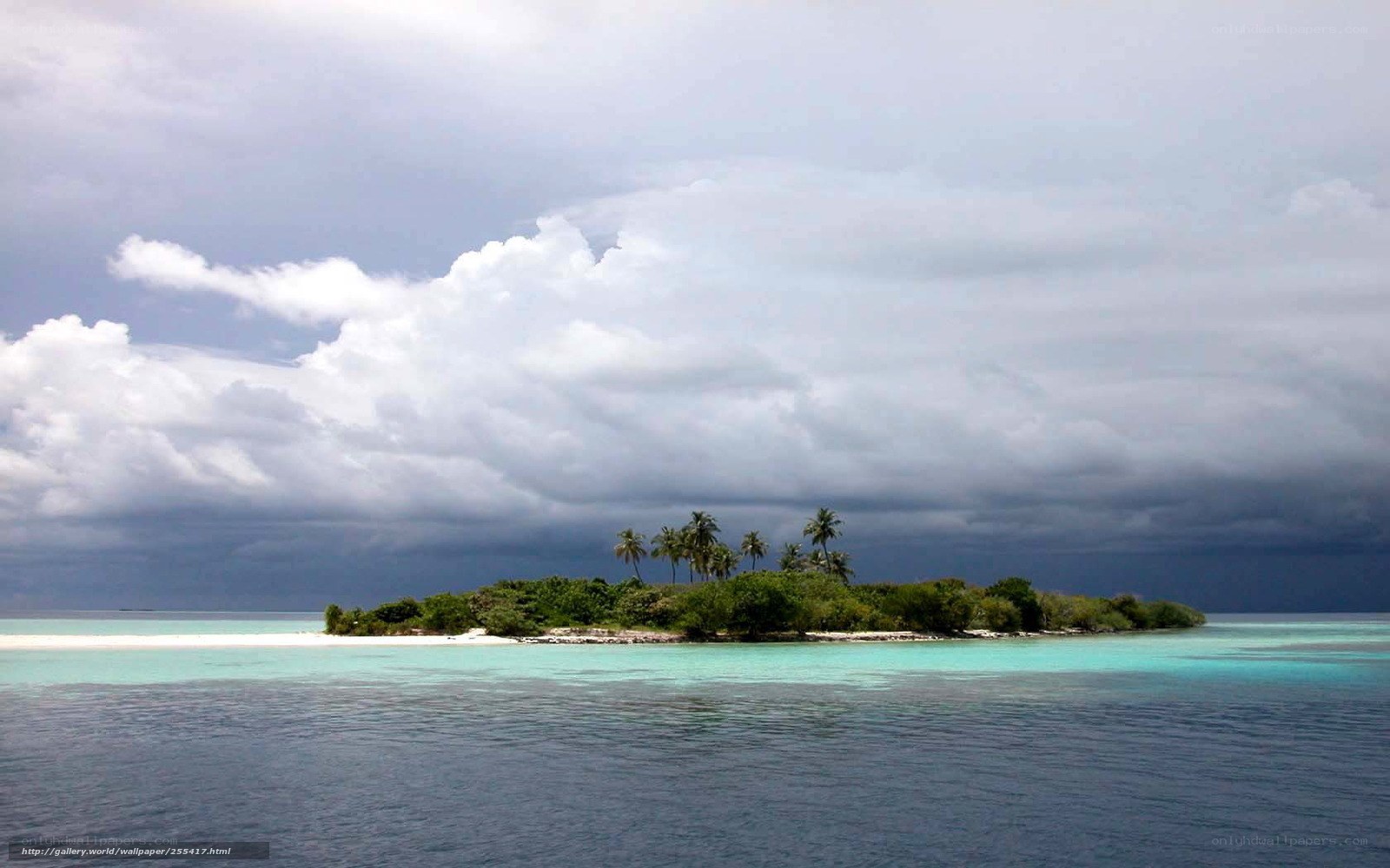 Tropical island under stormy sky