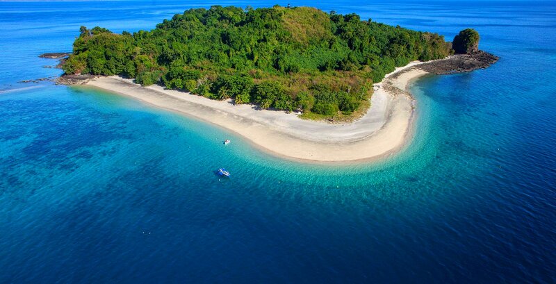 Tropical Island with Beach — Blue, Serene, Afternoon, Photograph, Boat