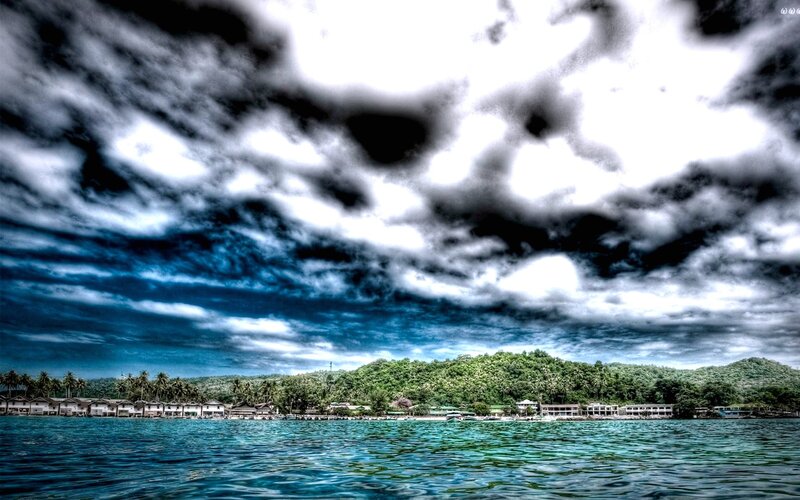 tropical island with dramatic sky