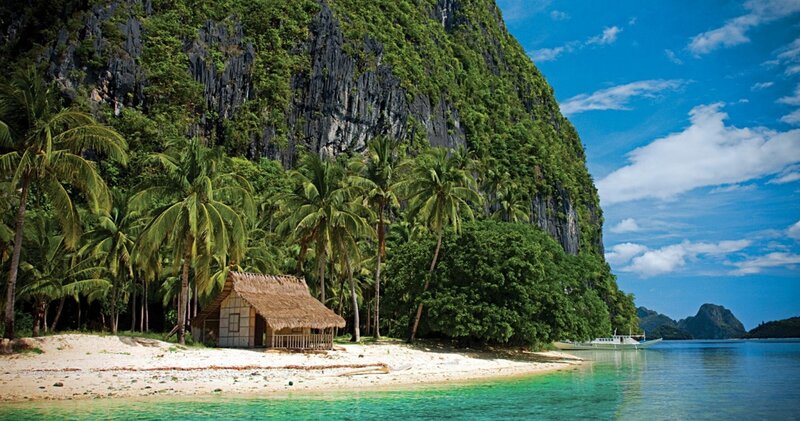 tropical island with hut and cliffs