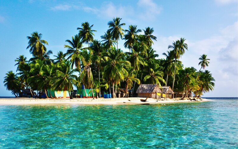 Tropical Island with Huts — Blue, Serene, Afternoon, Photograph, Palm Trees, Beach