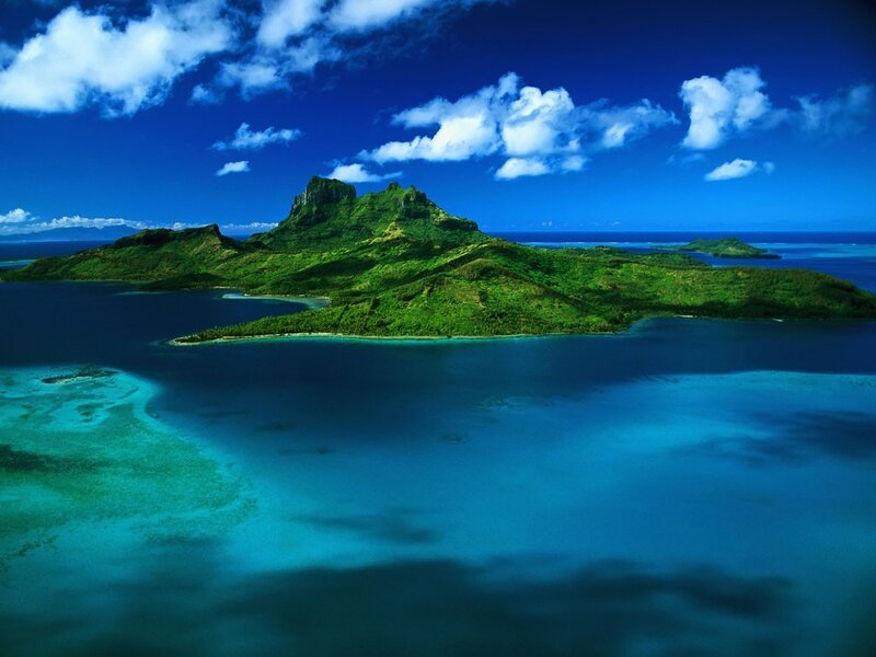Tropical island with lush green mountains