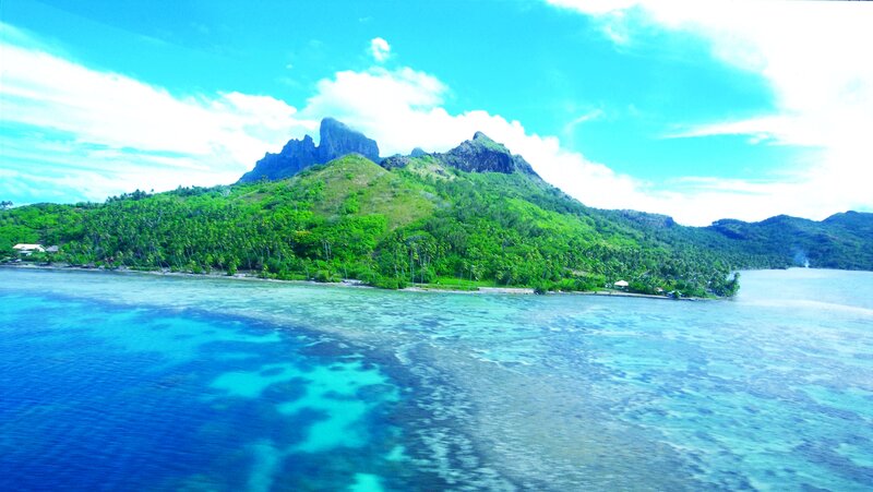 Tropical Island with Mountains — Blue, Serene, Afternoon, Photograph, Ocean, Coconut Palms