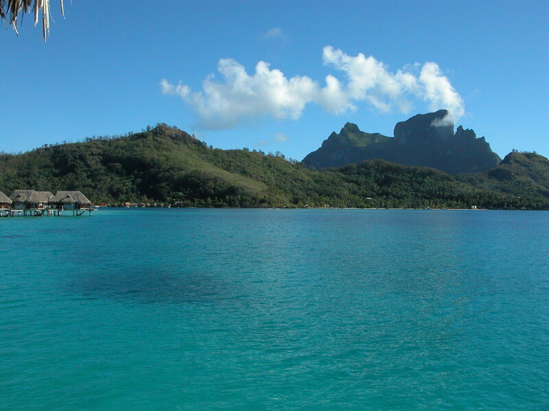 tropical island with overwater bungalows