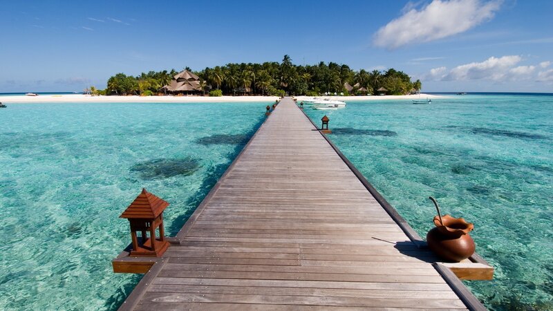 tropical island with wooden pier