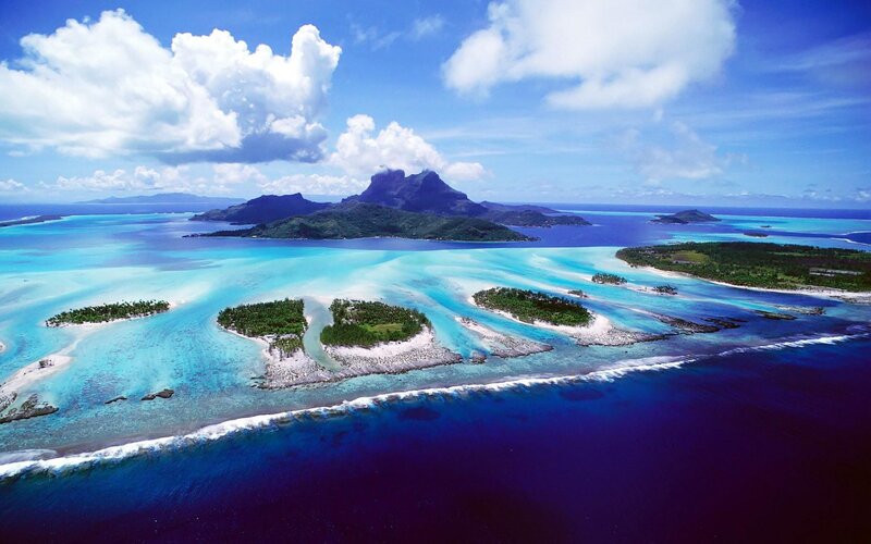 Tropical Islands and Lagoon — Blue, Serene, Afternoon, Photograph, Ocean, Clouds, Green