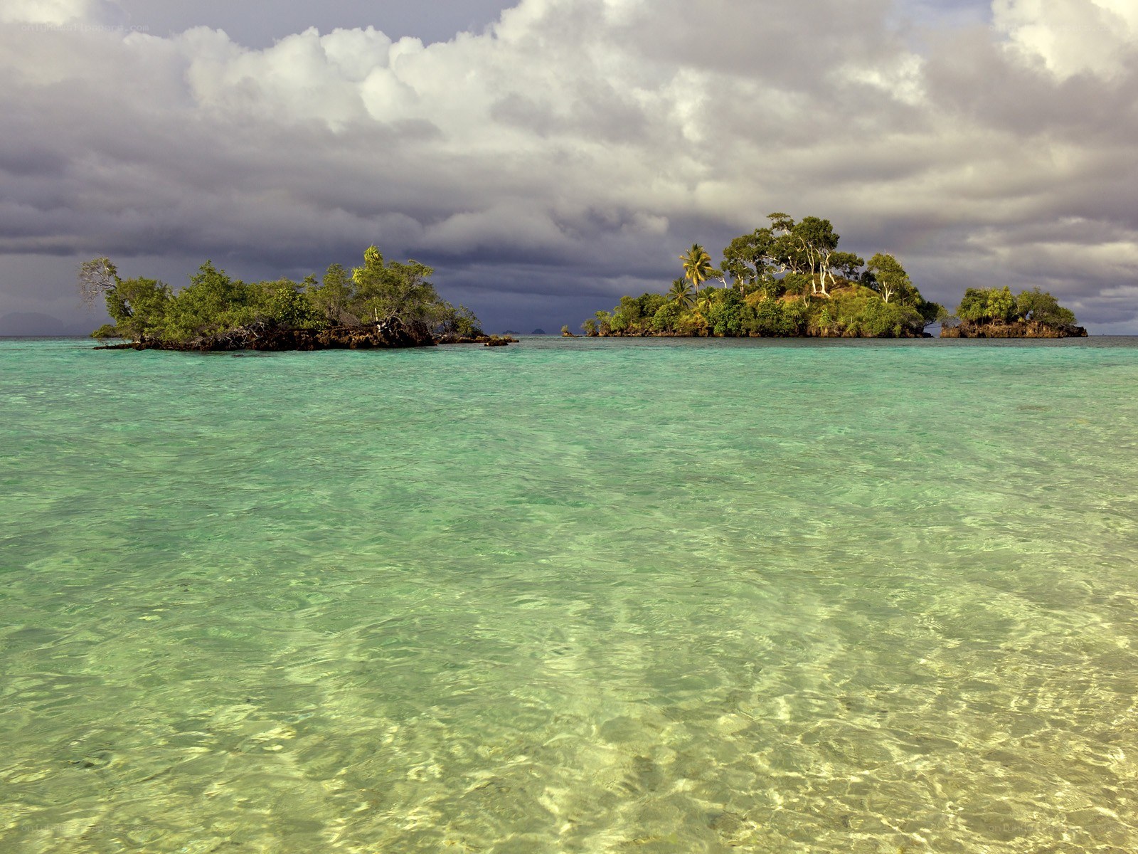 Tropical islands under cloudy sky
