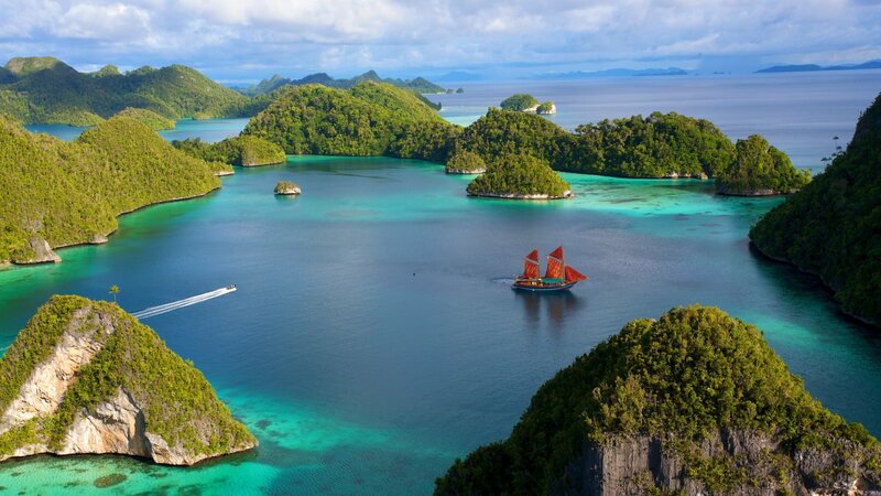 tropical islands with sailboat
