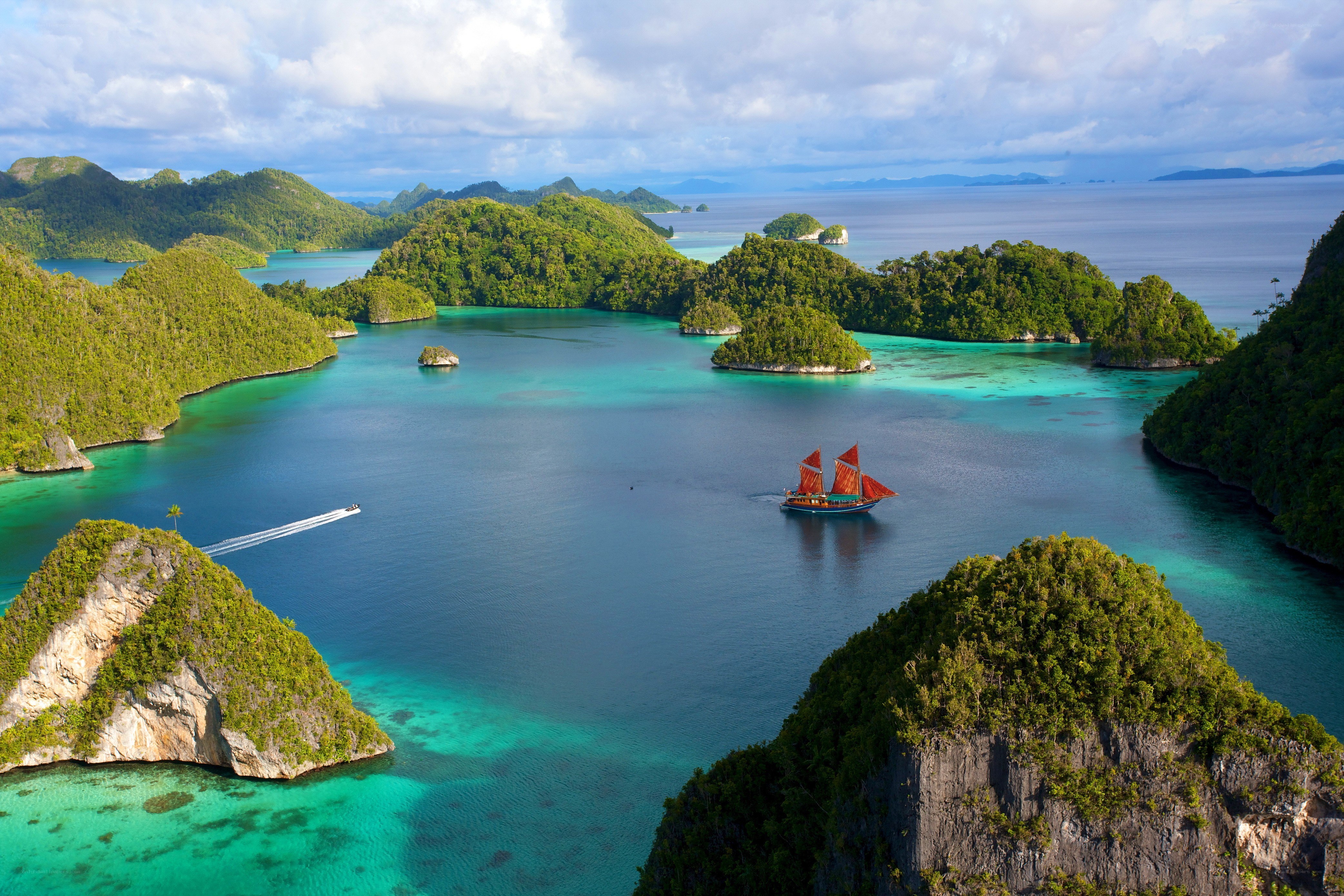 tropical islands with sailboat