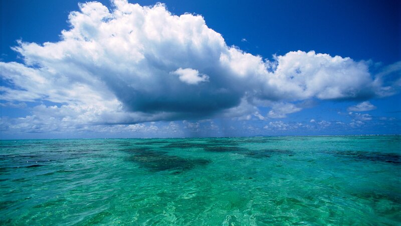 tropical ocean with storm cloud