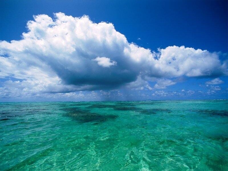 tropical ocean with storm cloud