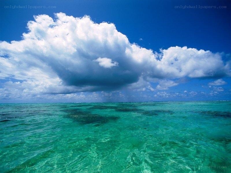 tropical ocean with storm cloud