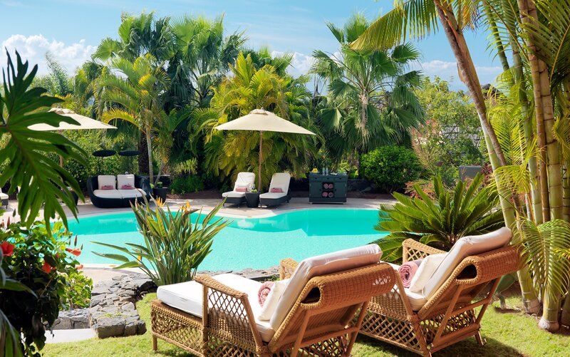 Tropical Pool Area — Green, Serene, Afternoon, Photograph, Lounge Chairs