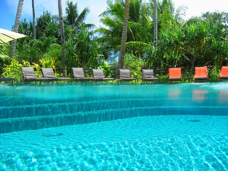 Tropical Pool with Lounge Chairs