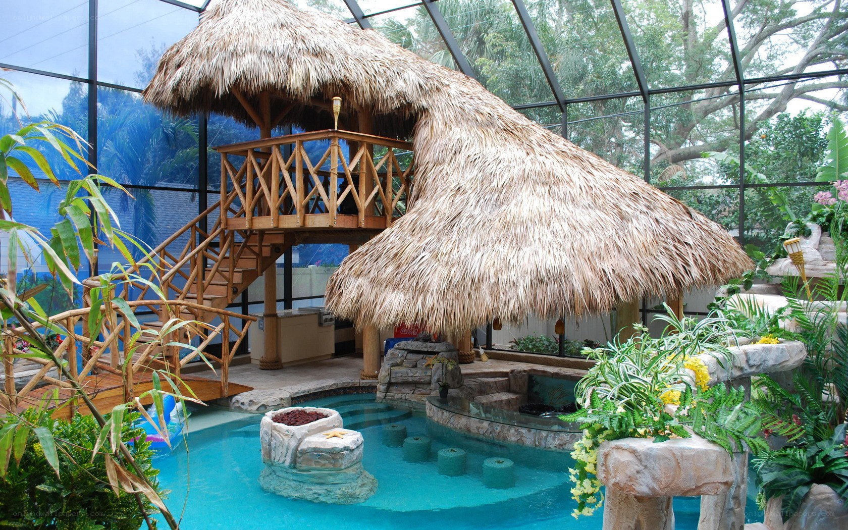 tropical pool with thatched hut