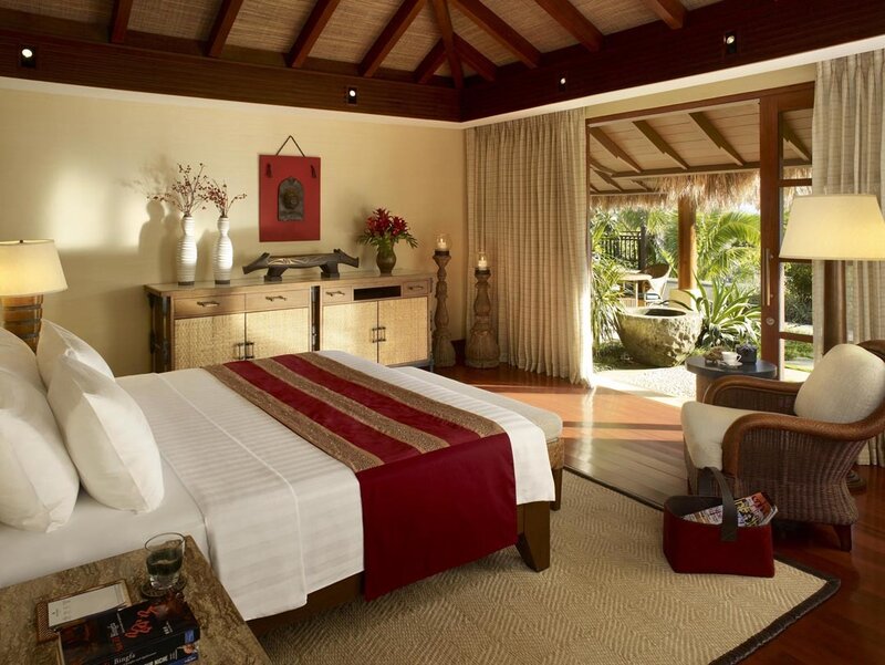 Tropical resort bedroom with outdoor view