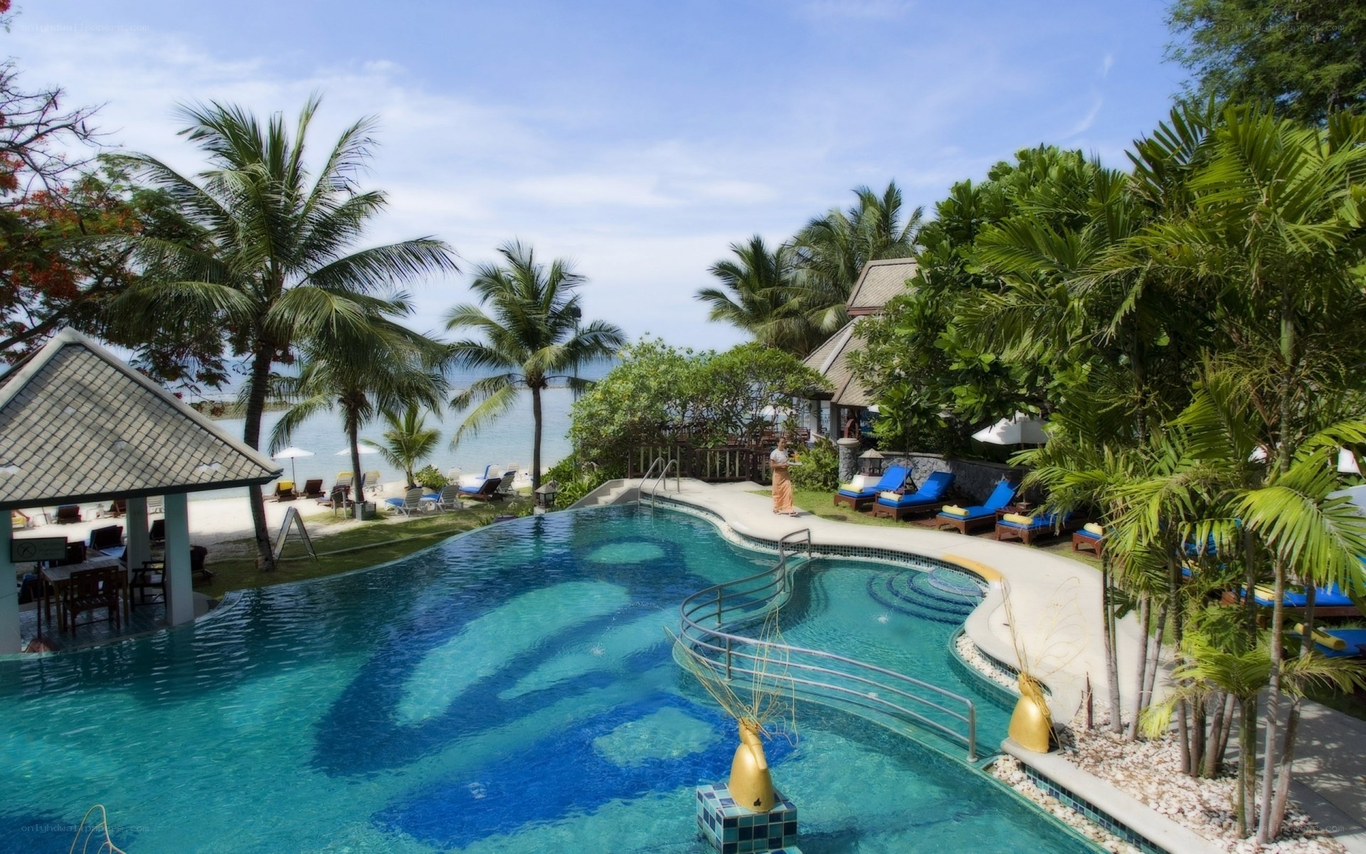Tropical resort pool and beach