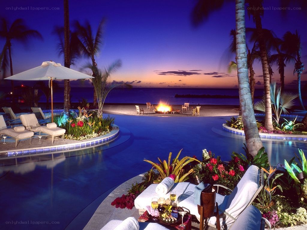 tropical resort pool at dusk