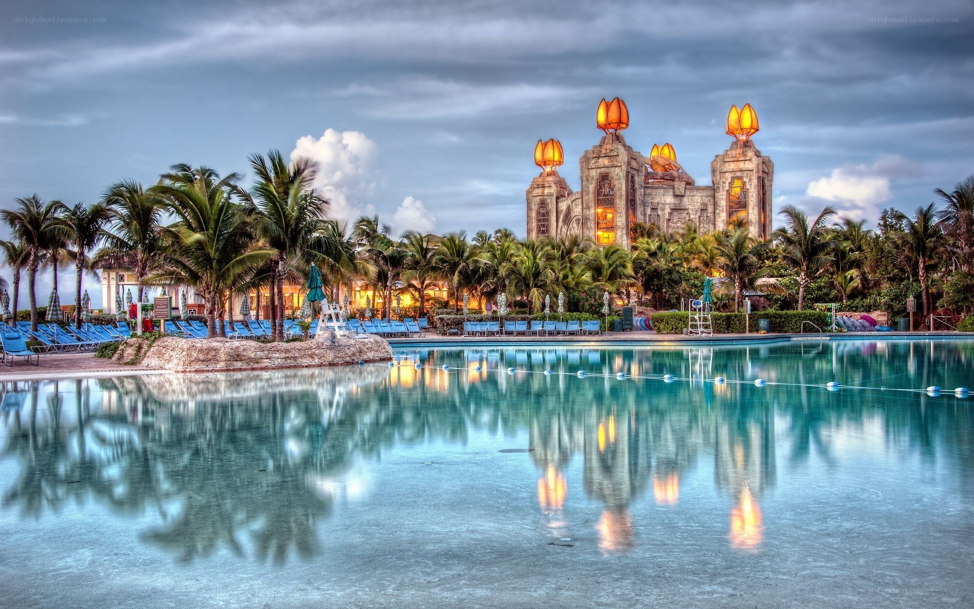 tropical resort pool at dusk