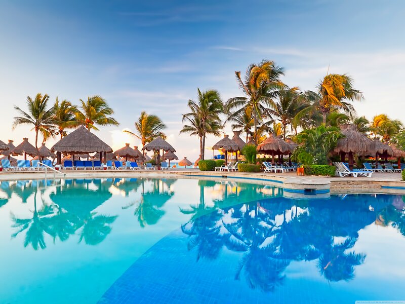 Tropical Resort Pool — Blue, Serene, Sunset, Photograph, Palm Trees, Thatched Umbrellas