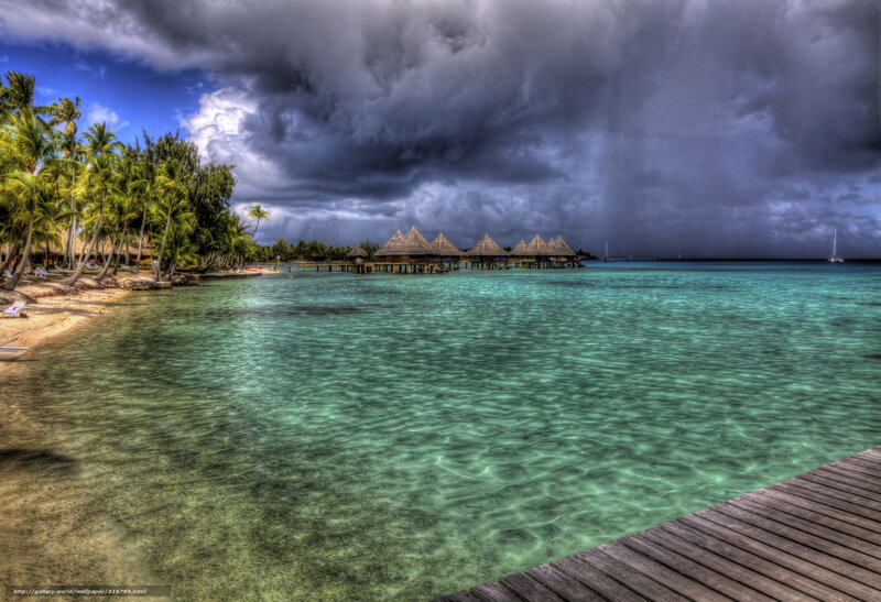 Tropical resort under stormy sky