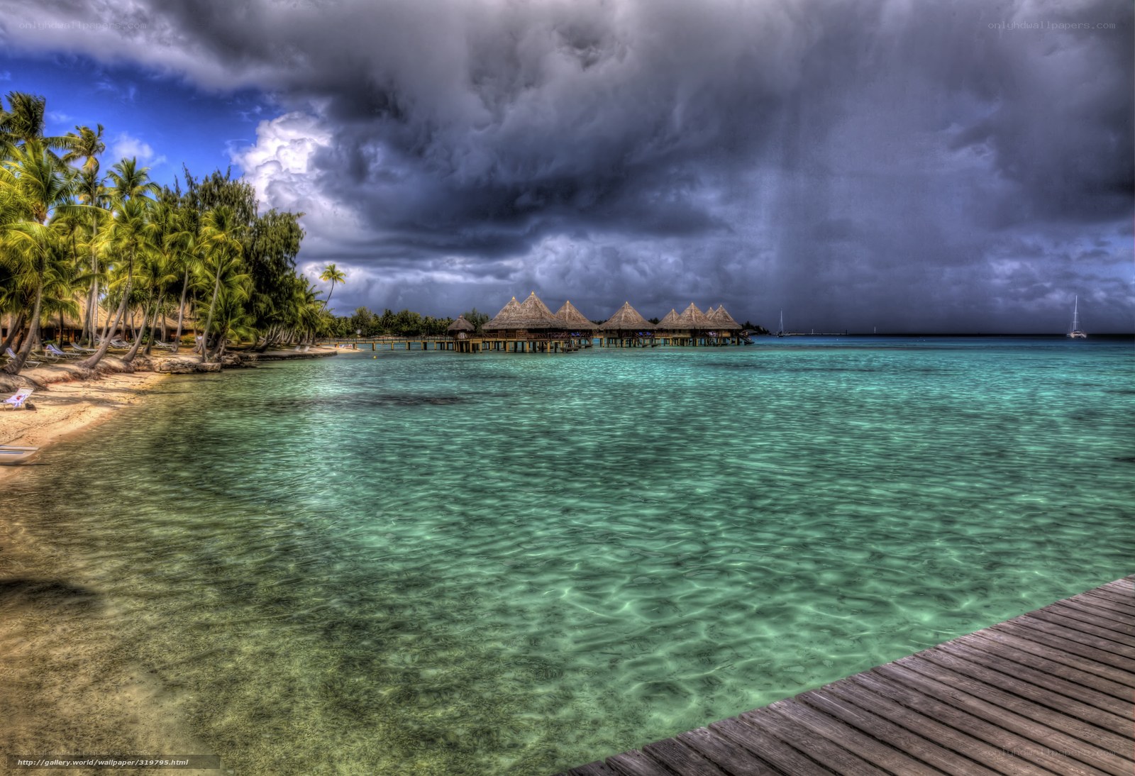 Tropical resort under stormy sky