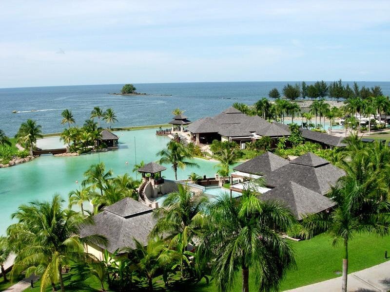 tropical resort with pool and ocean view
