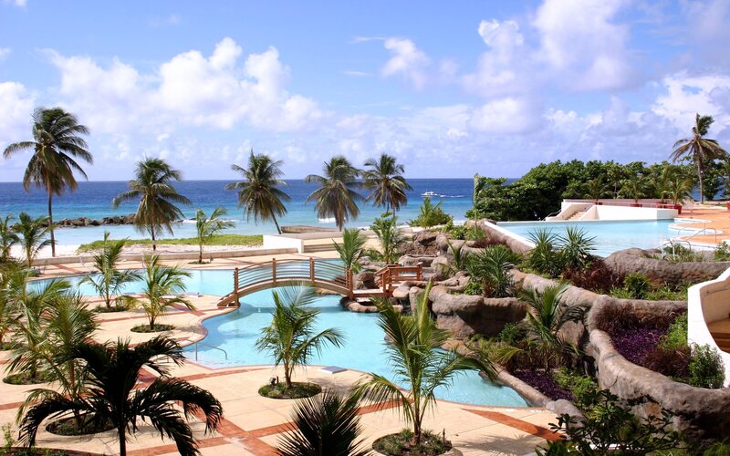 tropical resort with pool and ocean view
